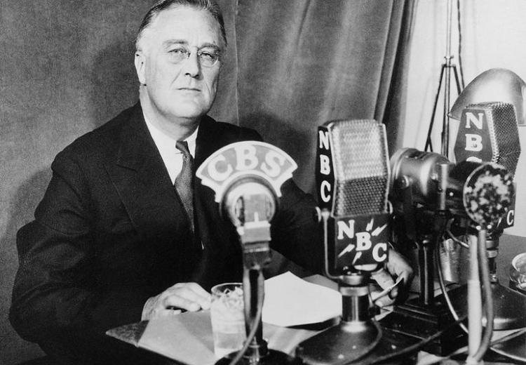 Photograph of Franklin D. Roosevelt at the White House in Washington, D.C., delivering a national radio address on September 30, 1934.